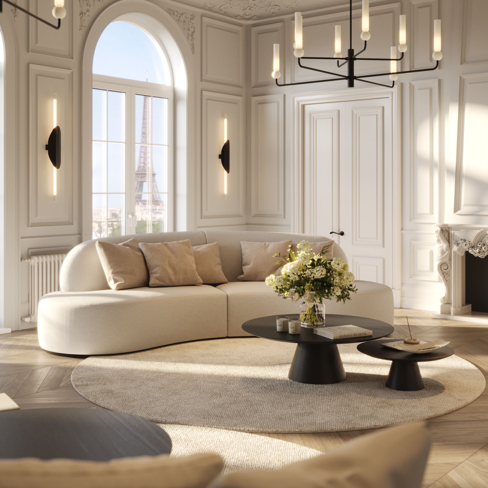 A curved beige Cotton Sofa sits in an elegant Parisian salon with ornate paneling, a round rug, and coffee tables topped with flowers and candles. The arched window framing the Eiffel Tower enhances the harmony of bespoke furniture, refined high-end furniture, and serene living room furniture.