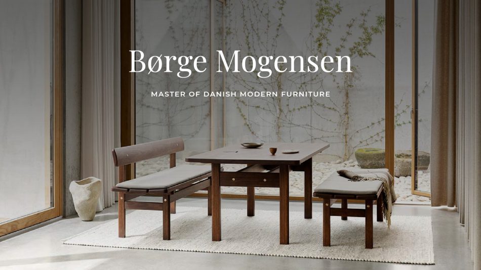 A minimalist dining setting features a dark solid‑wood table paired with two matching benches upholstered in soft grey cushions, arranged on a light woven rug before large floor‑to‑ceiling windows that open to a calm courtyard with pebbles and climbing greenery, expressing the balanced proportions, crafted simplicity, and functional elegance associated with Danish Modern furniture and Børge Mogensen’s design philosophy.