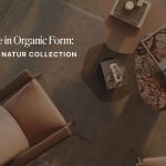 A warm, modern living space featuring wooden‑framed armchairs with soft blush cushions, arranged around a pair of sculptural Natur Coffee Tables in stone and lacquered finishes. Decorative candles, books, and textured accessories rest on the tables, enhancing the calm atmosphere. Soft lighting highlights the organic curves and natural materials that define the Natur Collection, reflecting the principles of organic furniture design, contemporary furniture aesthetics, and the quiet clarity of modern minimalist furniture.