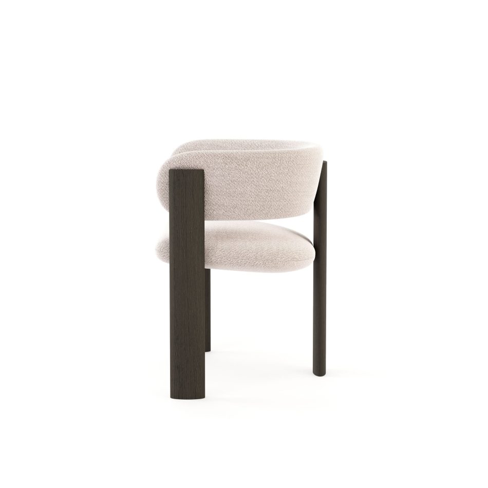 The Dolomites Chair reveals a gentle meeting of soft upholstery and dark brown wood, its curved silhouette shaped with a quiet strength that recalls mountain formations and settles naturally into refined interiors, resonating with dining room furniture, the crafted purity of handmade furniture, and the serene balance of luxury furniture.