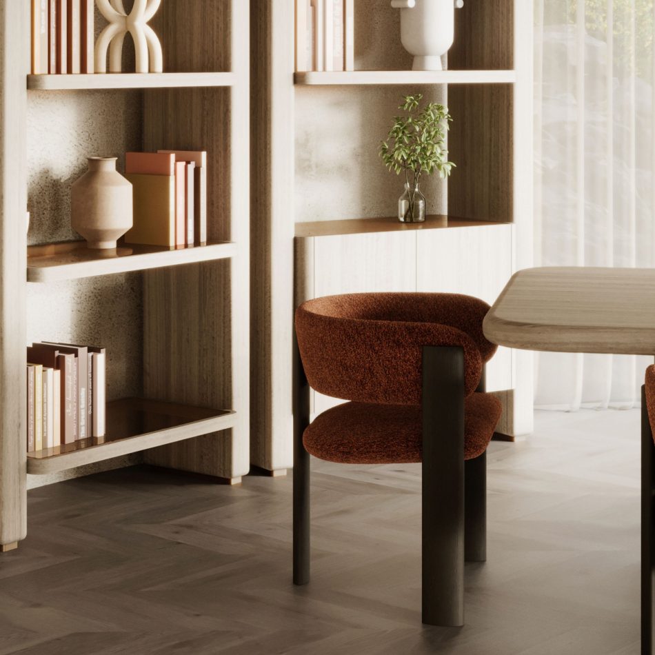 A warm dining corner features the Dolomites Chair upholstered in terracotta bouclé, its wood structure positioned beside a light wood table as soft natural light, curated shelving, and earthy tones create an inviting atmosphere that resonates with dining room furniture, the crafted refinement of luxury dining room furniture, and the contemporary harmony of furniture for living room spaces.