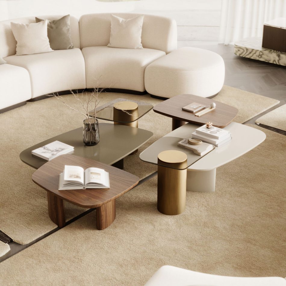 The Dolomites Coffee Table in wood, lacquer, and mixed materials appears in a warm minimalist living room where a curved sectional sofa, marble accents, and soft textures create a composed setting that mirrors the table’s coexistence of surfaces, heights, and organic irregularity, aligned with furniture for living room, the crafted clarity of modern furniture, and the sculptural calm of luxury home furniture.