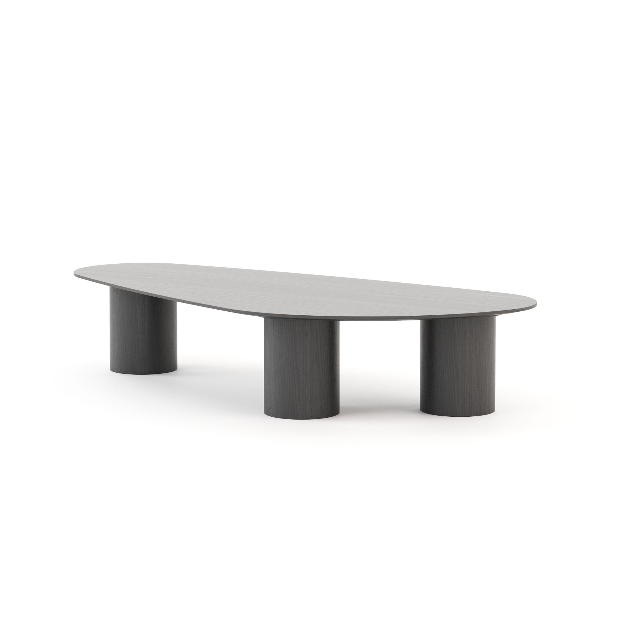 The Natur Coffee Table in dark wood, showcasing a sleek organic top and sculptural cylindrical legs. The rich tone and clean silhouette reflect contemporary furniture design and the refined simplicity of modern luxury furniture rooted in organic form.