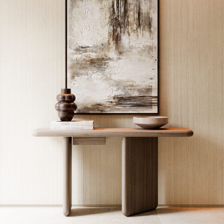 The Foz Console sits beneath a large abstract artwork, creating a cohesive visual dialogue between furniture and art. A sculptural vase, wooden bowl, and stacked books add layered texture and warmth. The styling reflects the quiet sophistication associated with luxury home furniture. Its clean geometry supports contemporary living room furniture arrangements. The scene embodies modern interior design inspiration through its restrained palette and balanced proportions.