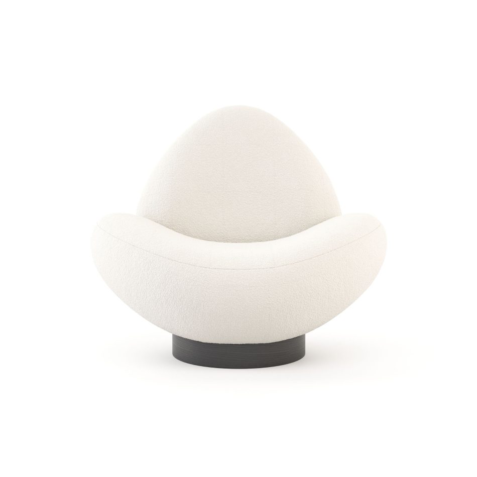 Stone Armchair reveals its flowing, cloud‑like contours and plush beige upholstery, shaped into an organic form that echoes river‑stone softness, elevated by a wood circular base that anchors the piece within refined living room furniture, expressive contemporary furniture, and the natural comfort associated with high‑end luxury home furniture.