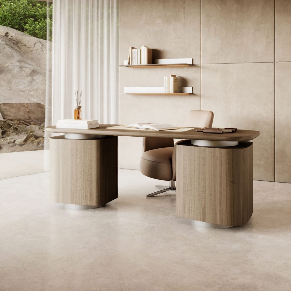 The Stone Desk is shown with a smooth wooden surface supported by sculptural cylindrical bases, styled with books and soft accessories in a serene workspace framed by warm paneling, floating shelves, and natural views, all subtly shaped by curated modern home furniture, gentle layers of workspace inspiration, refined touches of contemporary craftsmanship, and the calm elegance associated with thoughtful interior styling.