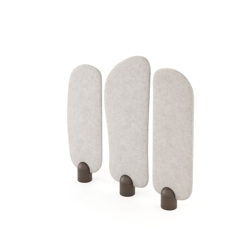 The Stone Screen is shown as three rounded panels upholstered in soft fabric, each one resting on a wooden base that grounds the gentle curves. The subtle differences in shape and height create a slow, contemplative rhythm that mirrors the patience of natural erosion, embodying the crafted restraint of custom furniture and the quiet elegance central to luxury home furniture.