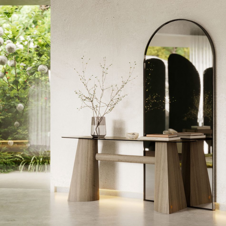 The Stone Screen appears reflected in the arched mirror behind the console table, its fabric panels rising with gentle organic curves that introduce a slow, calming rhythm to the room. The surrounding greenery and soft daylight create a peaceful atmosphere where the warm wooden bases and flowing silhouettes enhance the thoughtful craftsmanship of high end furniture.