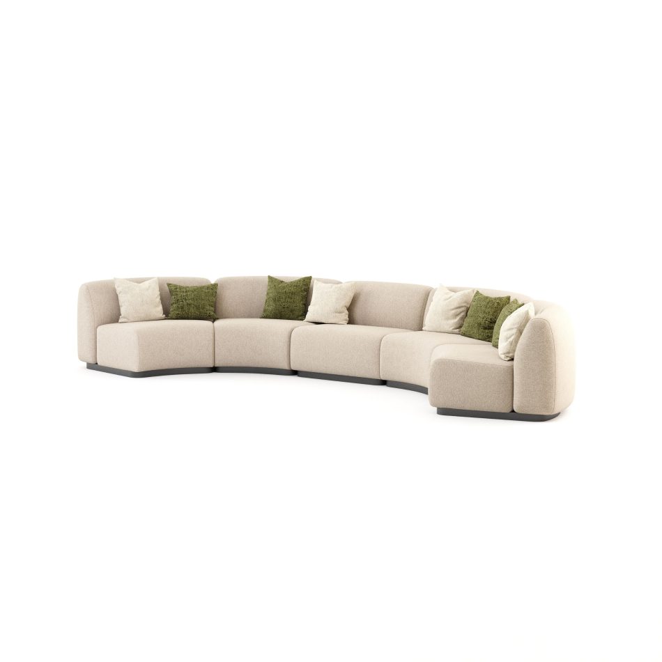 The Stone Sofa is shown in a five‑piece curved modular layout upholstered in light beige fabric, arranged in a soft semi‑circle and styled with green and beige throw pillows that highlight its organic, stone‑inspired silhouette, creating a calm focal point enhanced by touches of modern furniture, subtle interior design inspiration, refined bespoke living room styling, and a sense of elevated luxury home furniture.