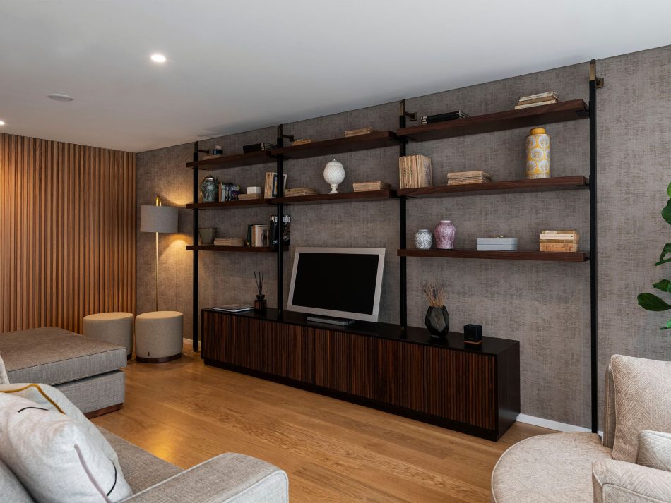 A modern living room where the Sublime Stools add a soft, rounded detail to the space. The His TV Cabinet and Bespoke Ryan TV Cabinet create a clean, structured focal point with their warm wood finishes. The overall atmosphere is calm and balanced, shaped by contemporary design and luxury furniture elements.