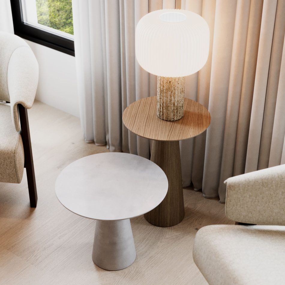 A pair of Olivier Side Tables, one in micro cement and one in wood, arranged beside upholstered seating, with a textured lamp resting on the wooden table. Soft natural light and layered textures create a serene atmosphere, emphasizing the harmony of luxury furniture, the tactile presence of natural materials, and the understated elegance central to elemental‑inspired interior design inspiration.