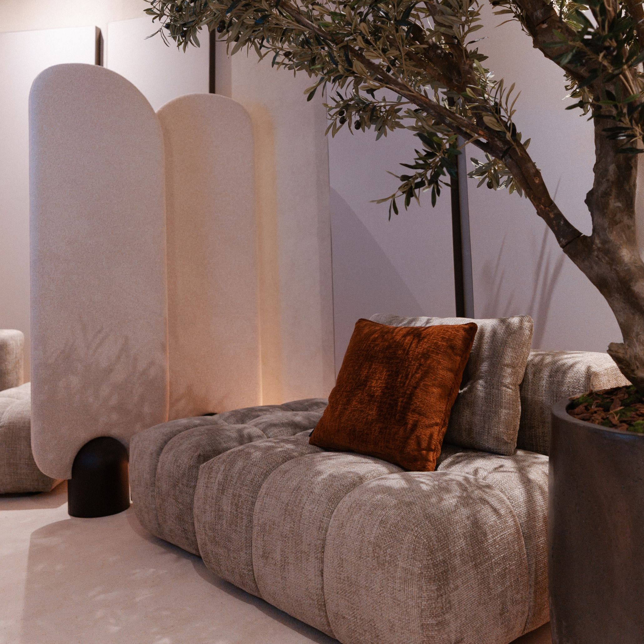 The private area creates an intimate, softly lit environment anchored by the Antónia Modular Sofa, whose warm tones and curved silhouette bring comfort to the space. Beside it, the Stone Screen introduces a sculptural rhythm that enhances the room’s sense of privacy while maintaining a natural flow. A potted tree and gentle lighting complete the atmosphere, reflecting the quiet elegance of luxury home furniture, the crafted identity of modern furniture, and the calm refinement associated with thoughtful design details.
