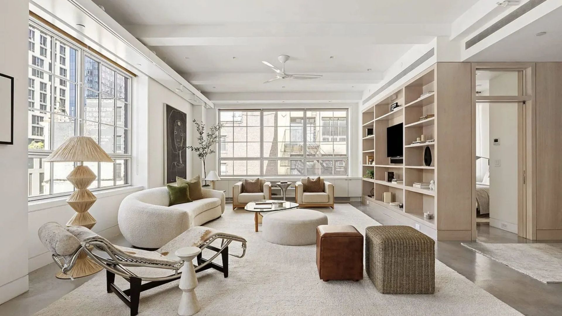 A serene living room showcasing the Le Corbusier LC4 chaise lounge, where soft textures and sculptural forms echo the refined proportions of luxury living room furniture, the crafted precision of bespoke furniture, and the clean aesthetic that defines modern luxury furniture.