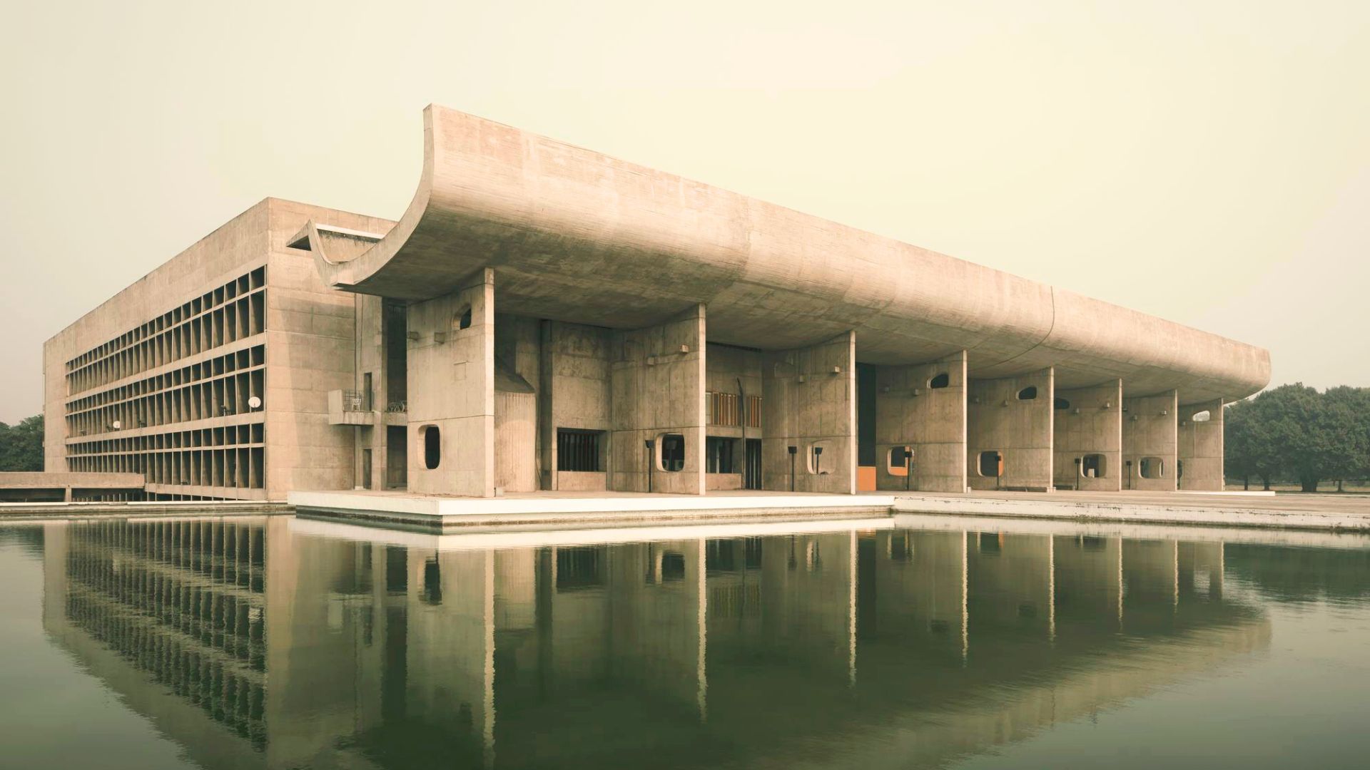 The monumental concrete form of the Palace of Assembly reflects Le Corbusier’s lasting influence, where bold geometry, structural clarity, and sculptural presence continue to inspire luxury furniture, inform the refined proportions of high end furniture, and guide the thoughtful design approach behind modern luxury furniture in contemporary interiors.