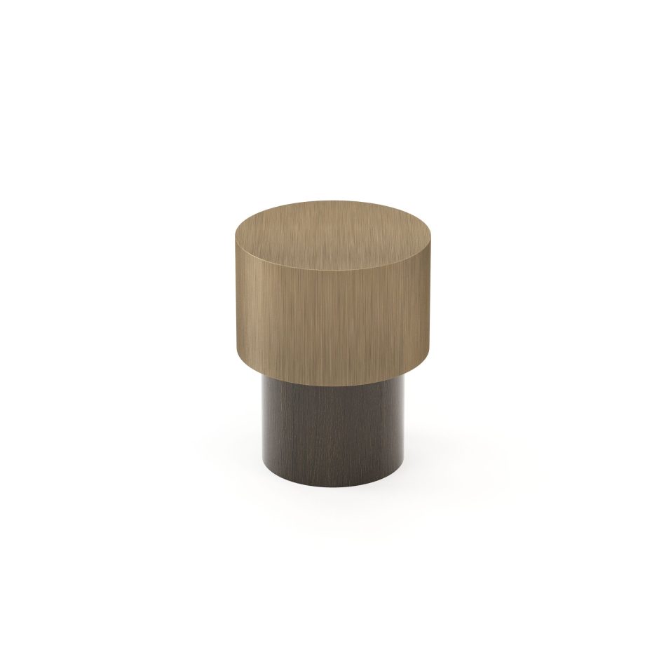 A warm metallic cylinder rests atop a darker wooden base in the Toro Side Table III, emphasizing material contrast and minimalist geometry. Its clean silhouette enriches sophisticated environments with high end furniture, supports curated styling in luxury home furniture, and aligns with elevated interior design inspiration.