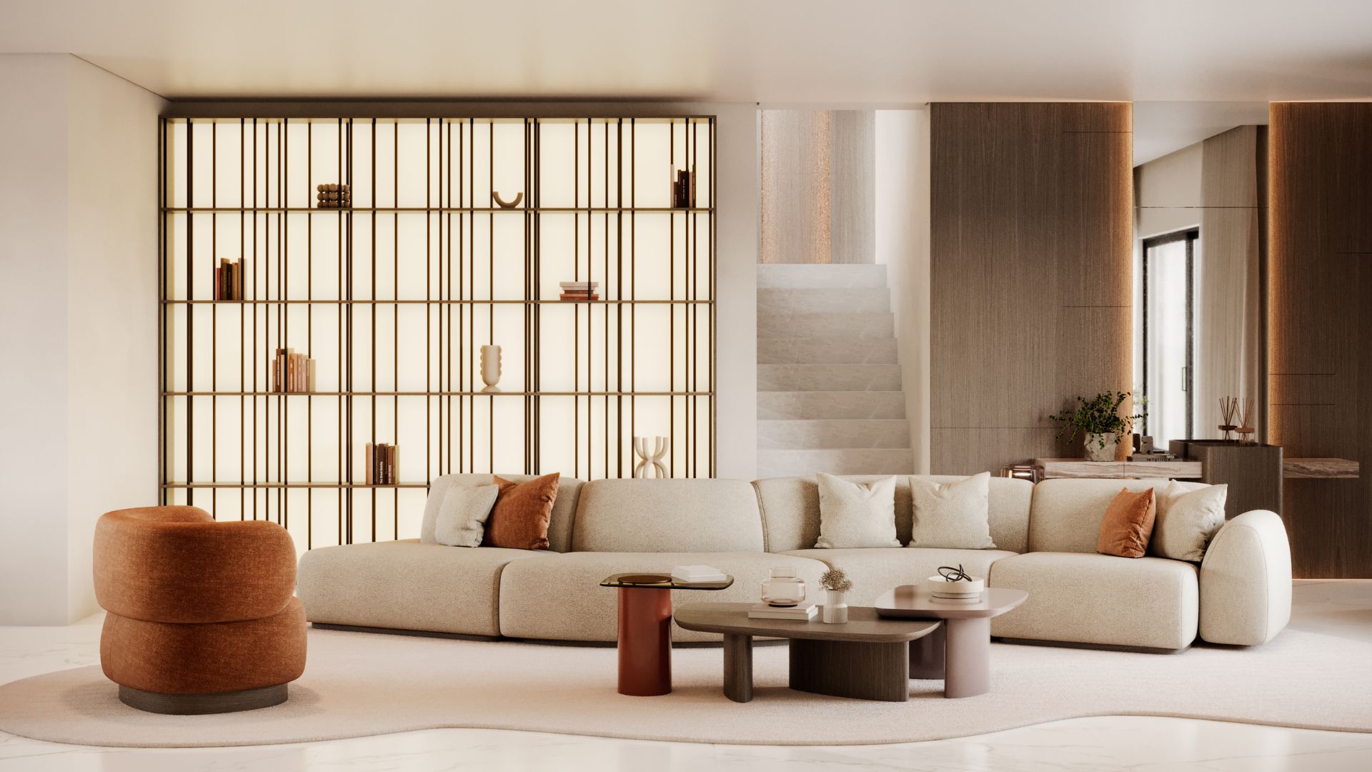 The living room features a spacious arrangement of modular sofas in soft beige tones, styled with neutral and rust‑colored cushions that highlight the adaptability of modern sofa design. A rounded accent chair and two sculptural coffee tables sit in front of the seating, while a backlit shelving unit with decorative objects adds depth to the space. Warm lighting, clean architectural lines and a mix of natural materials create an elegant, inviting atmosphere characteristic of contemporary furniture.