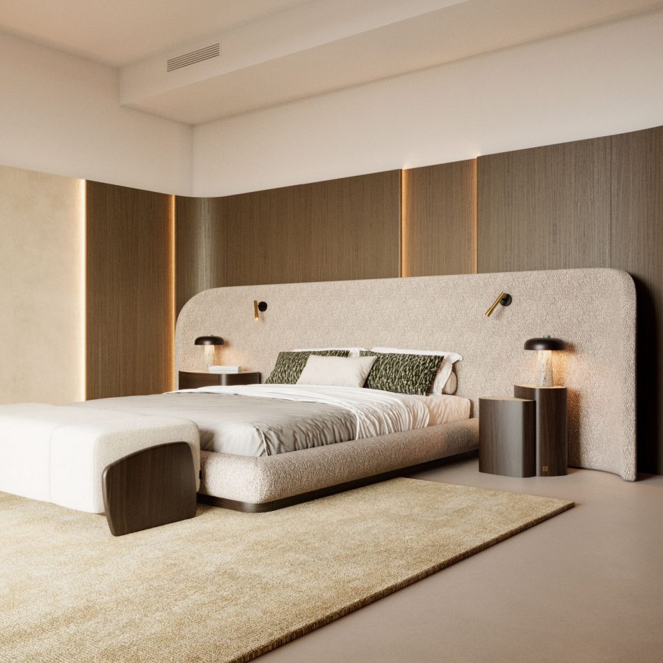 The Stone Bed anchors a warm, minimalist bedroom with its curved upholstered headboard and soft neutral bedding, framed by vertical light panels and textured materials. The space blends luxury bedroom furniture, subtle design details, and calming interior design inspiration.