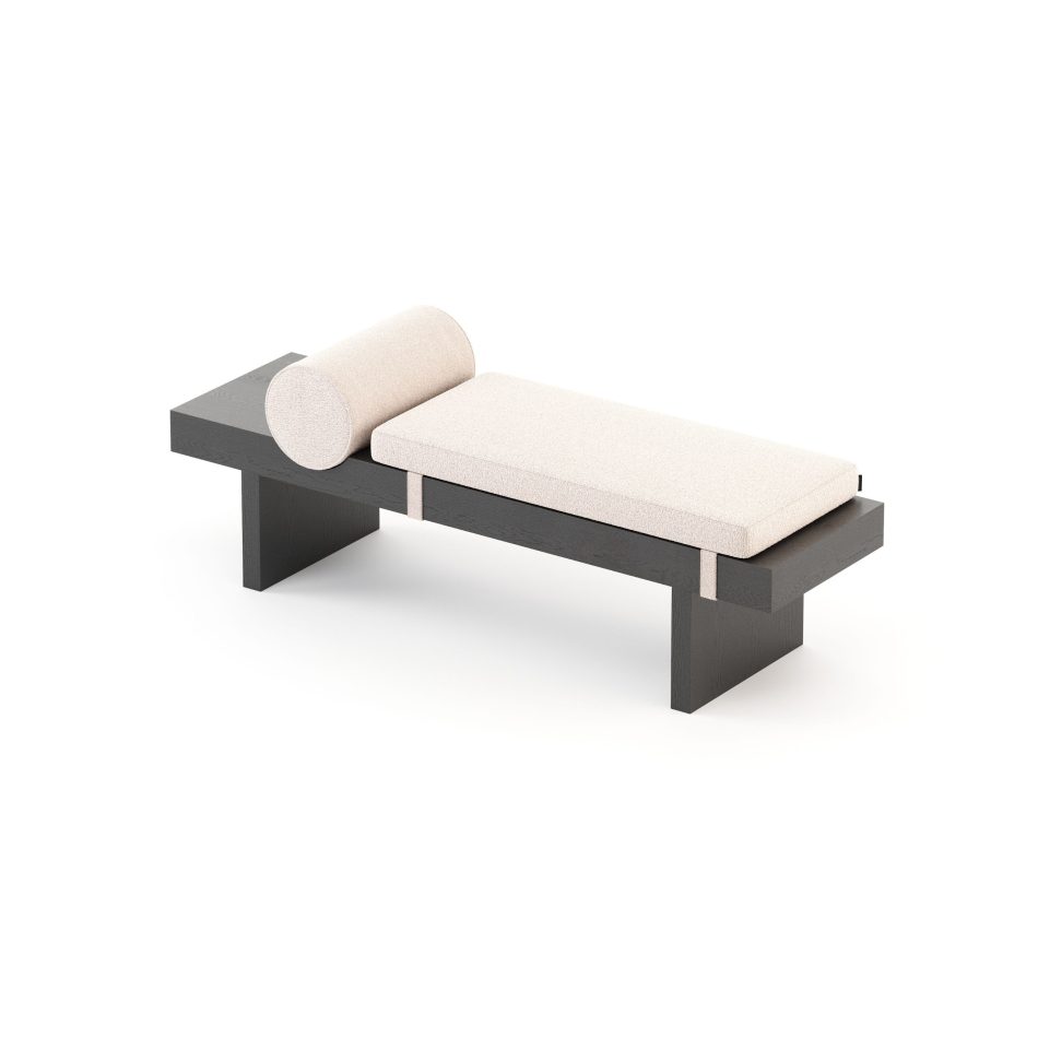 An angled view of the Toro Bench reveals the dialogue between its solid wooden base and the upholstered cushion with a cylindrical bolster, emphasizing comfort through restraint. The thoughtful detailing and measured proportions embody contemporary furniture and refined design details, offering a calm, architectural rhythm to transitional spaces.