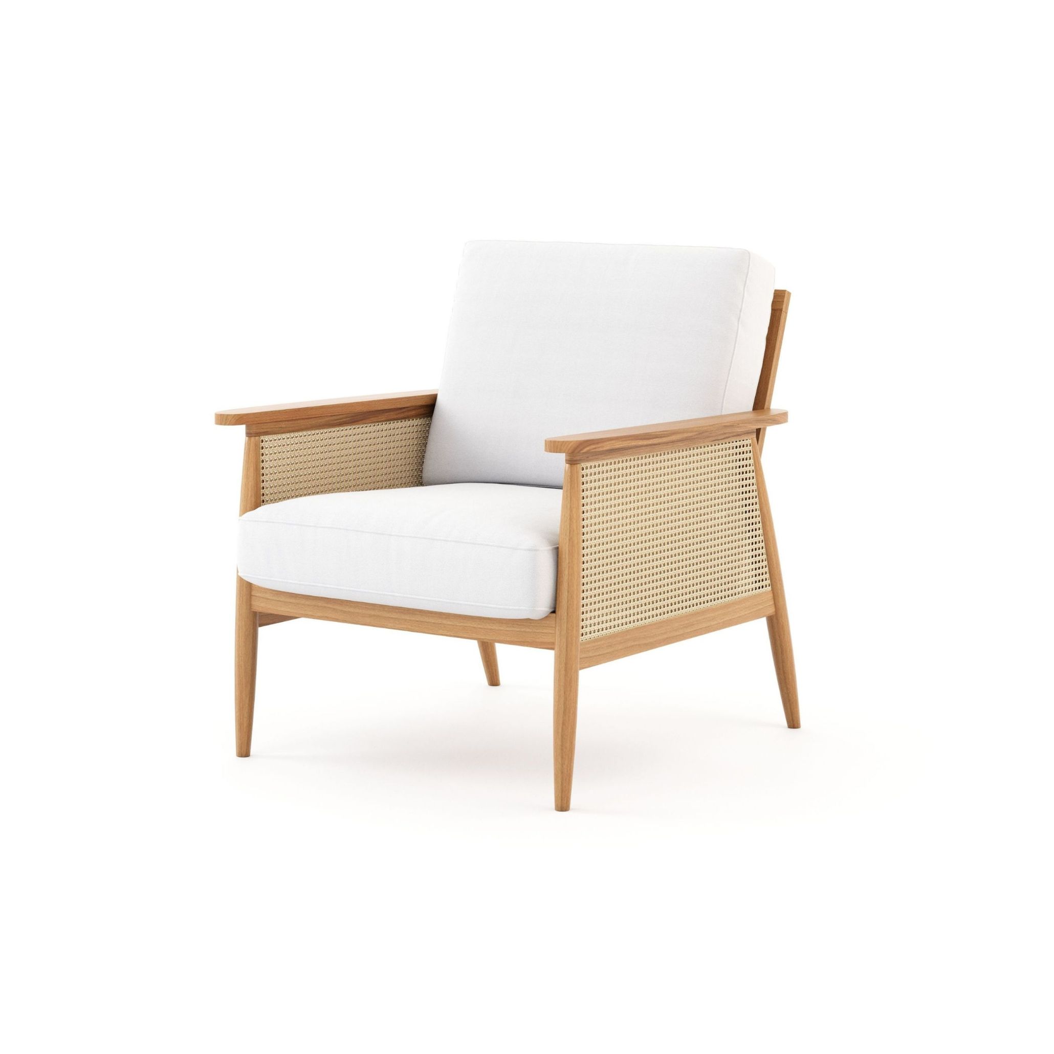 The Natur Armchair combines a tapered solid wood frame with woven cane side panels and generously cushioned white furniture upholstery fabric, creating a piece that balances craft and comfort. Its natural tones and handmade furniture quality make it an ideal fit for bespoke living room spaces inspired by the Comporta aesthetic, where tactile materials and organic forms define every detail.