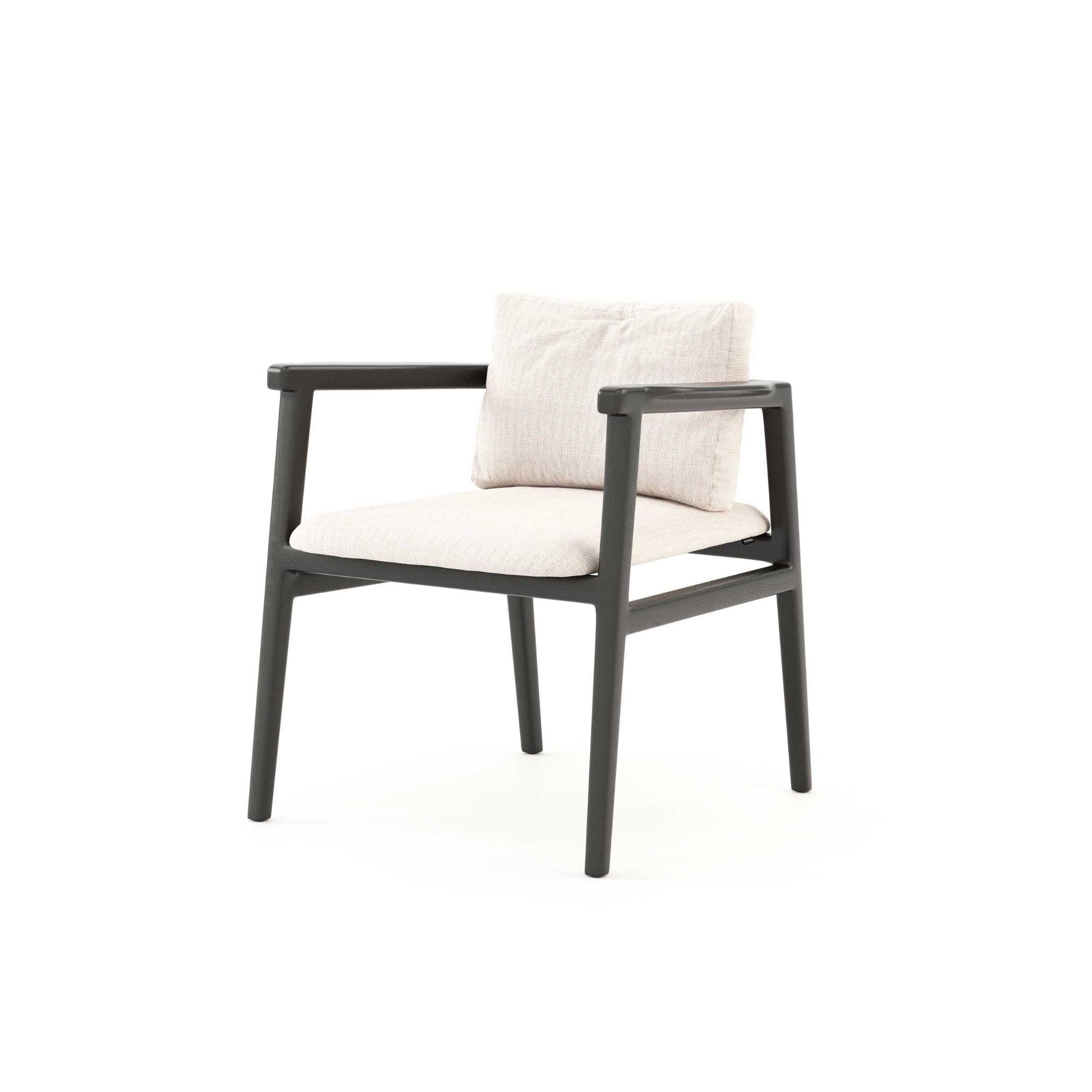 The Toro Chair with a dark wood frame, tapered legs and cream furniture upholstery fabric seat and back cushions. Its precise joinery and minimalist design give it a quiet architectural presence, making it a natural fit for luxury dining room furniture settings that value craft, restraint and material honesty.
