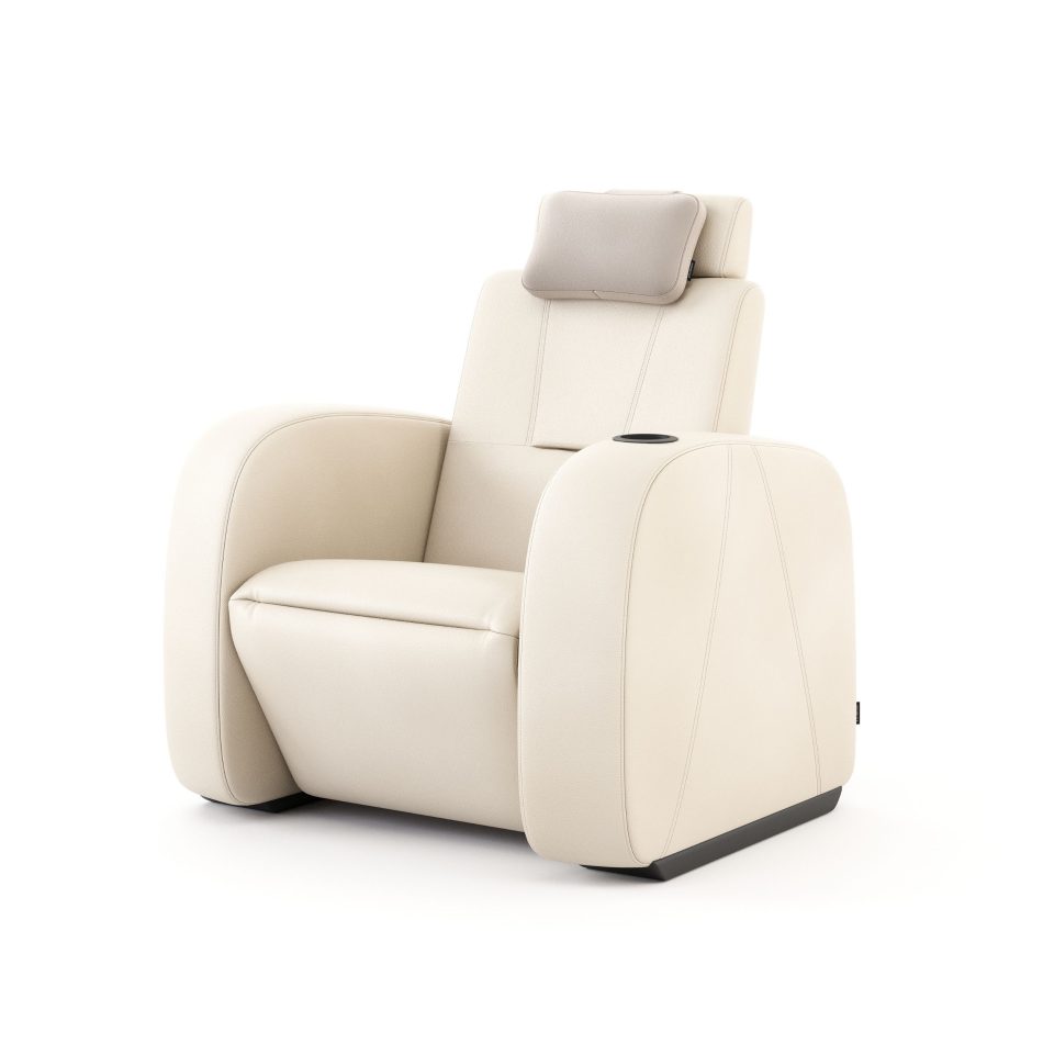 Lumière Cinema Armchair in cream leather upholstery seen from the side, revealing the armchair's sculptural silhouette, panel stitching detail, and integrated cup holder on the armrest. A luxurious furniture piece that brings design details and measured proportions to the most considered home furniture and private cinema settings.