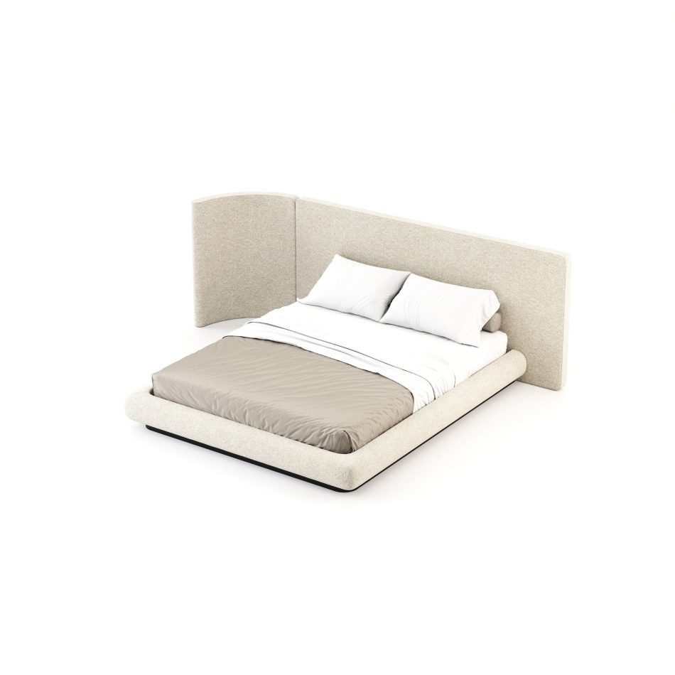 Natur Bed seen from above at an angle, revealing the full wrap of the asymmetric upholstered headboard in natural greige furniture upholstery fabric and the generous soft surround of the low platform frame. The duality and contrast between the curved organic panels and the precise dark metal base reflects the best handmade techniques behind this piece of luxury master bedroom furniture designed to bring lasting calm to the space.