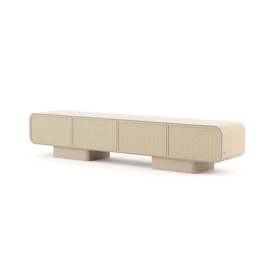 The Natur TV Cabinet stands on a white background, its long rounded silhouette in light finest wood softened by four woven rattan front panels. Two block-form bases lift the piece off the ground, creating a sense of lightness beneath the generous storage volume. This tv cabinet reflects a minimalist design approach where material and proportion define the piece, making it a natural reference point for living room inspiration.