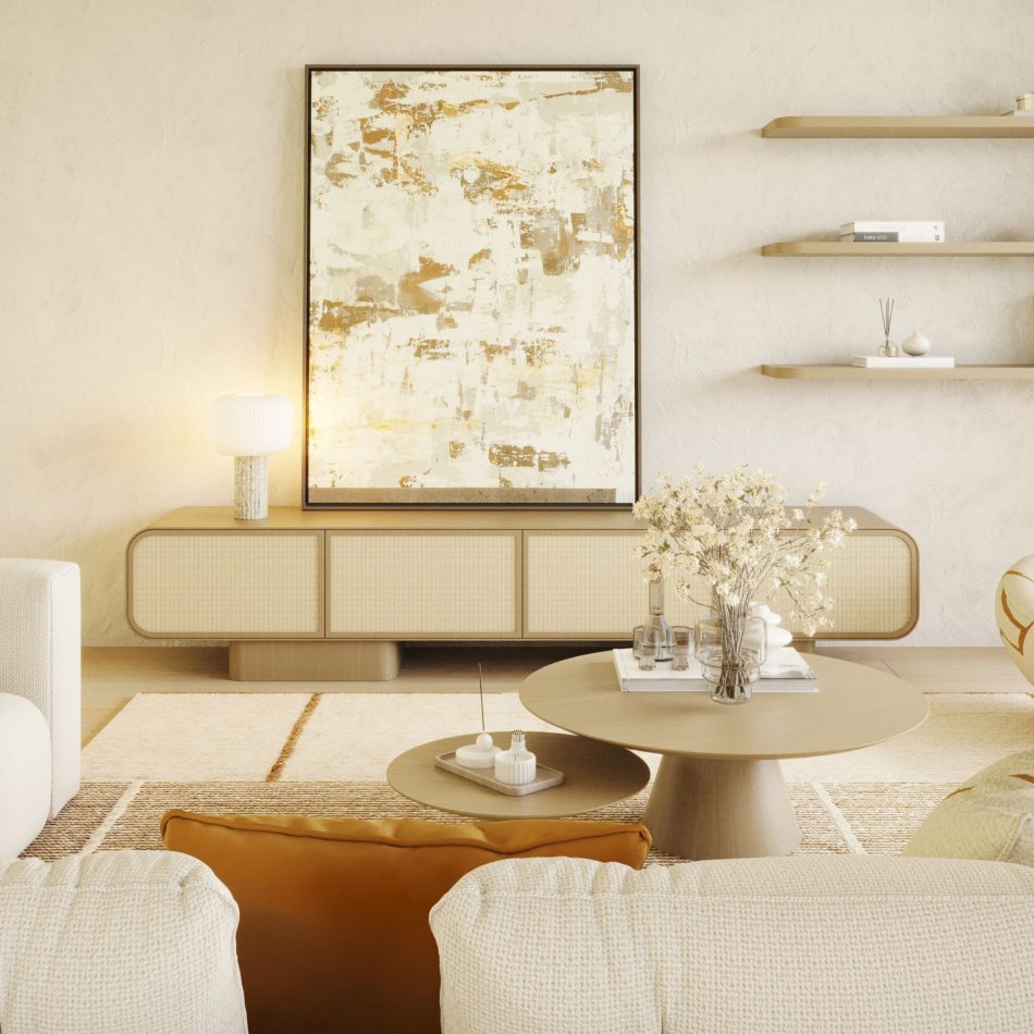 The Natur TV Cabinet in pale finest wood anchors a neutral living room, its woven rattan fronts set beneath an abstract gold and cream artwork. Floating shelves above hold books and ceramics, while a round coffee table in matching wood tones sits before a cream bouclé sofa with mustard cushions. This tv cabinet brings organic warmth to a space defined by living room inspiration and natural materiality.