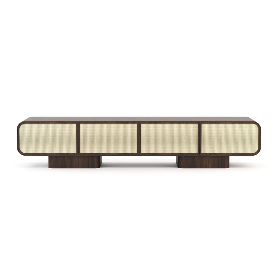 The Natur TV Cabinet is shown front-on in dark walnut against a white background, its woven cane doors set within a smooth rounded case supported by two rectangular bases. The rich wood tone deepens the contrast against the pale rattan, highlighting the design details that define this piece of contemporary furniture.