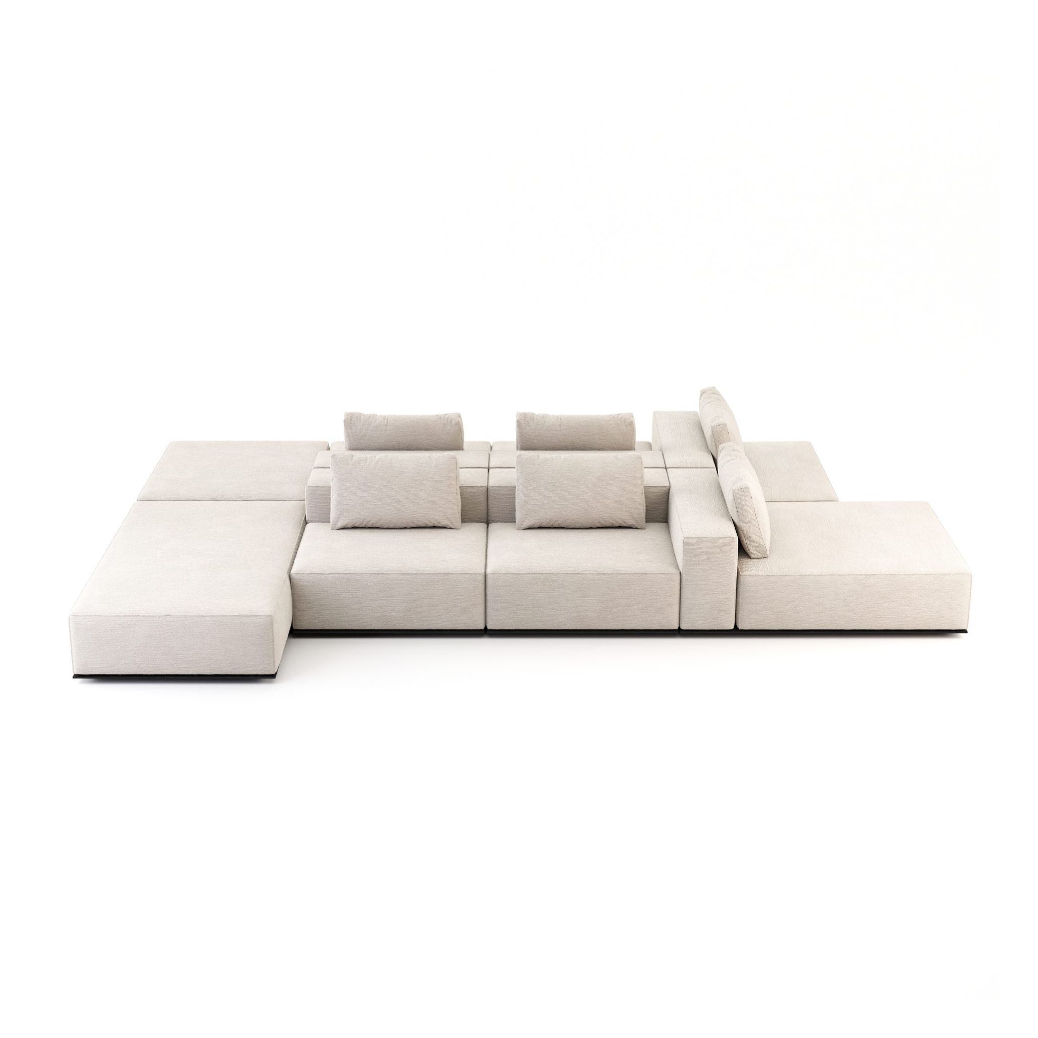 The Landform Sofa is shown in full on a white background, its modular sections in pale upholstery fabric arranged with staggered seat heights and bolster cushions. The generous, grounded volume reflects an architectural approach to furniture, where the bold sofa holds its place in a room with structural conviction.