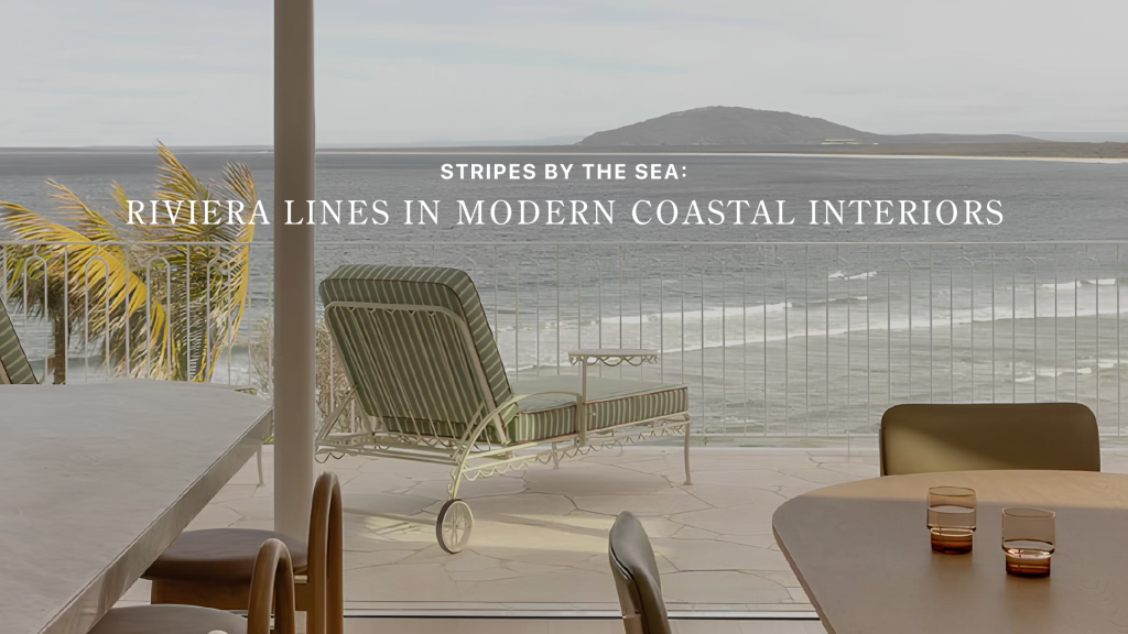Banner image for "Stripes by the Sea: Riviera Lines in Modern Coastal Interiors" showing a green-and-white striped chaise lounge on a stone terrace overlooking a wide bay, an example of luxury home furniture shaped by Riviera Lines.