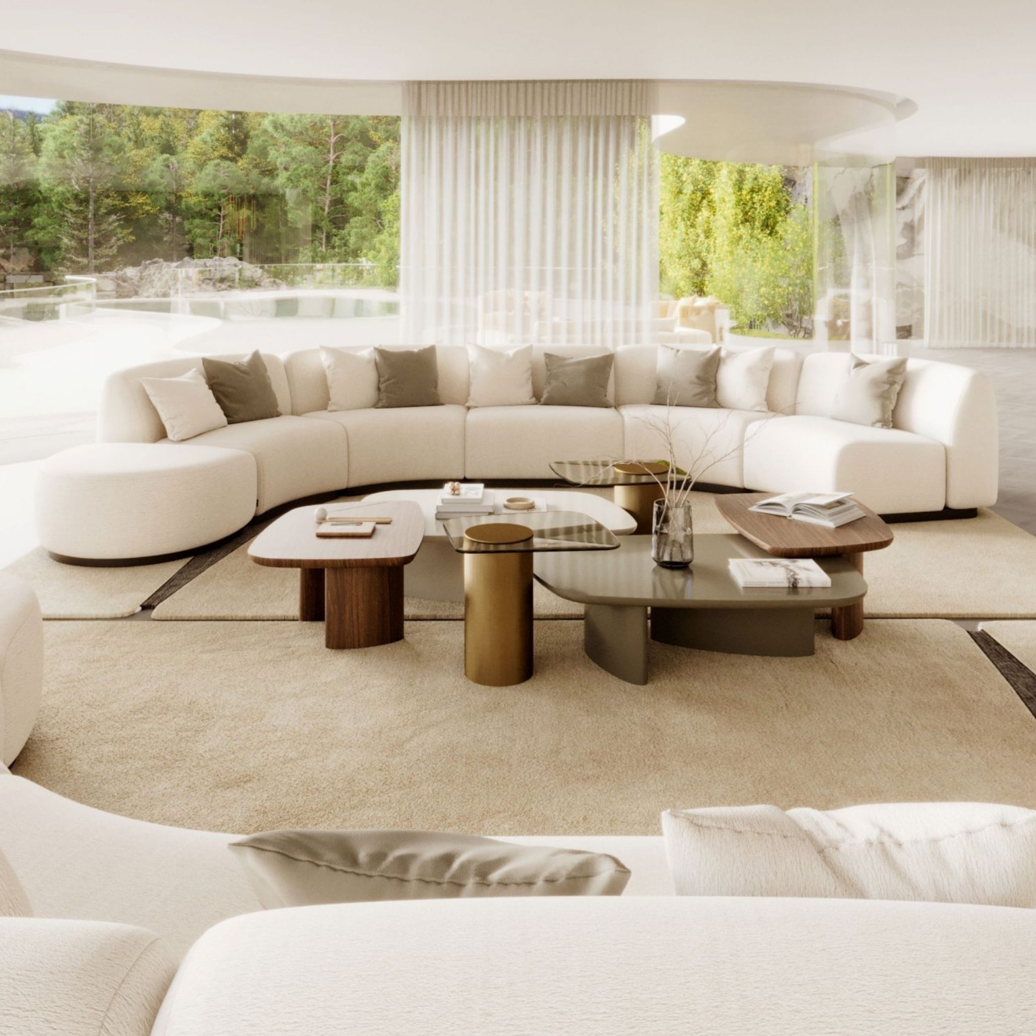 A sunlit, glass-walled living room built around a curved sectional sofa in ivory bouclé, dressed with beige and taupe cushions and surrounded by a cluster of low mixed-material coffee tables in wood, brass and glass. Overlooking a garden and pool, the room's rounded forms, warm wood texture and neutral palette capture the kind of luxury living room furniture, living room architecture and interior design inspiration associated with quiet, sculptural living room design.