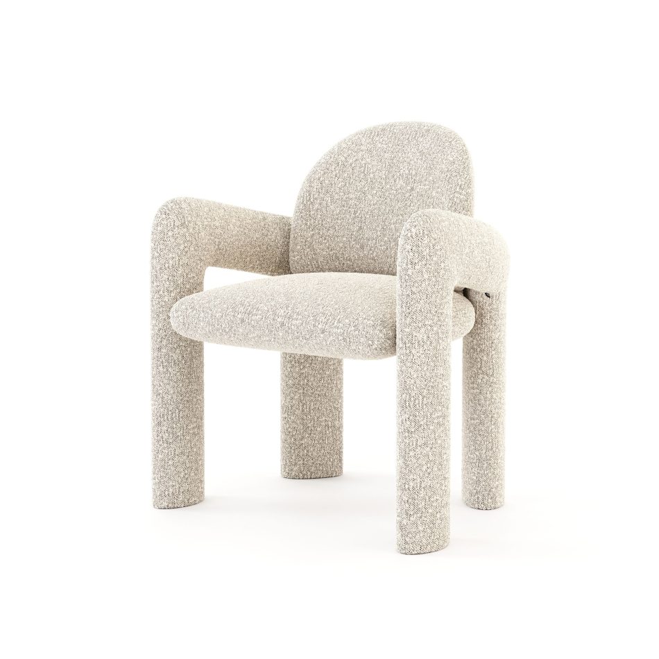 The Stone Chair, its arched backrest and thick rounded arms upholstered in flecked ivory bouclé, supported by four sturdy cylindrical legs finished in the same fabric. A striking piece of living room furniture that brings an organic contemporary silhouette and quiet sculptural presence into any interior.