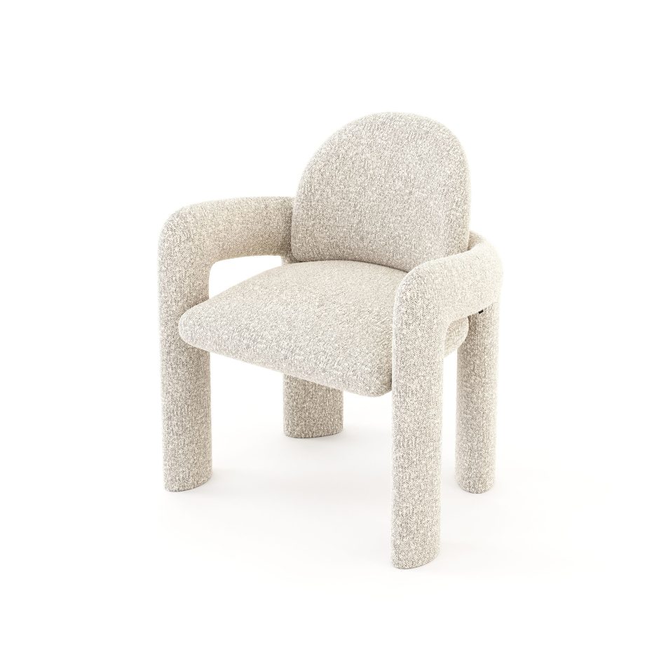 The Stone Chair, capturing its full profile: curved arms, arched back, and cylindrical legs upholstered in soft ivory bouclé. A example of luxury home furniture offering clear interior design inspiration for contemporary spaces.