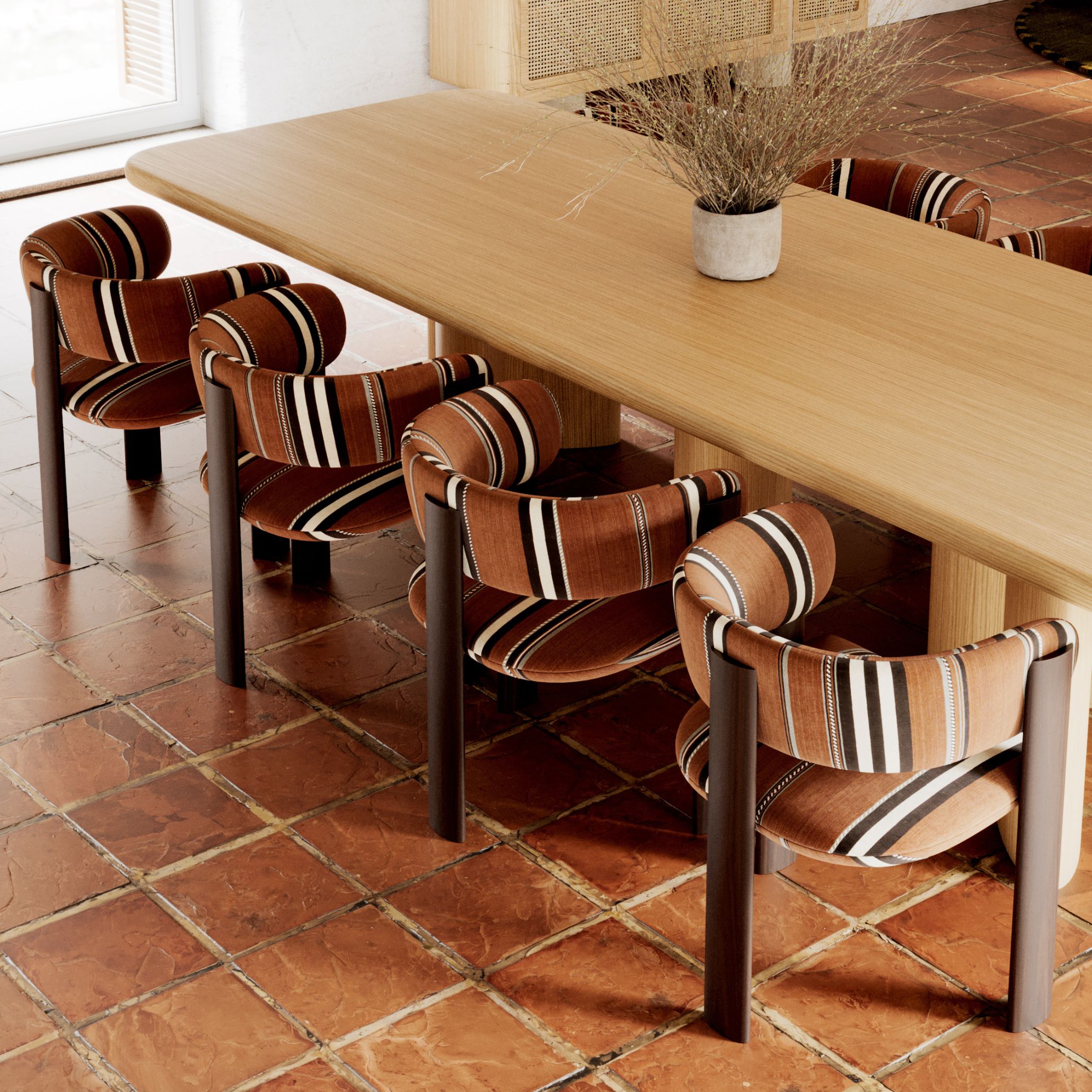 The Dolomites Chairs upholstered in rust-toned striped furniture fabric, arranged around a light oak dining table on terracotta tile, a contemporary take on stripes design within luxury dining room furniture.