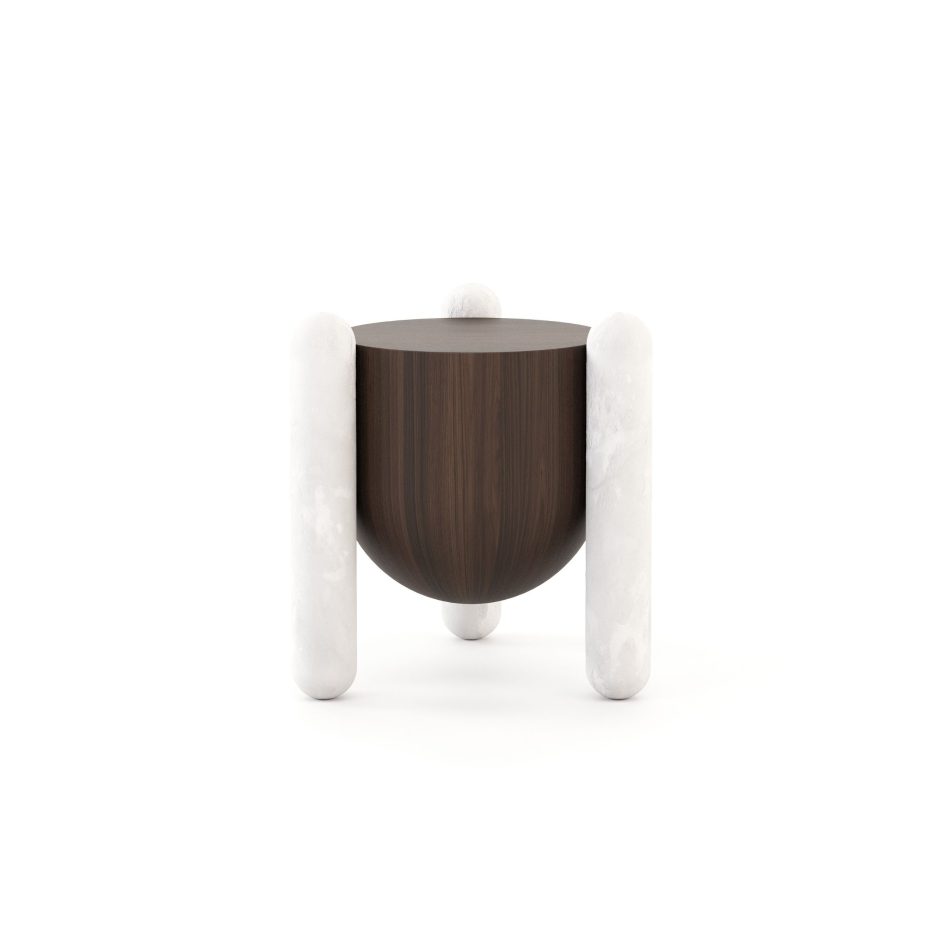The Antónia side table, showing its rounded, arch like marble legs framing a curved dark wood body finished in a rich walnut veneer. Inspired by Portuguese architecture, this piece of contemporary furniture balances the strength of marble with the warmth of wood, embodying a sculptural take on modern design.