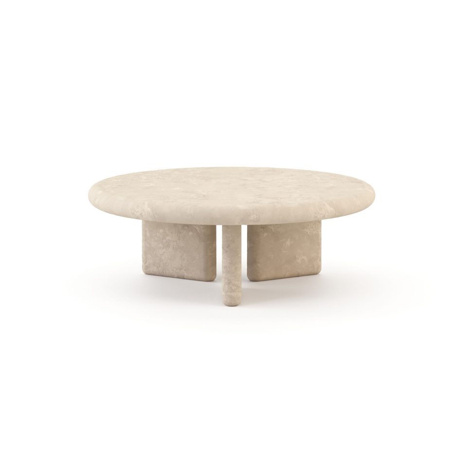The Foz Coffee Table in a soft microcement finish, its round top resting on three organic, root-like supports with a rough, textured surface. The generous, unbroken silhouette reflects the quiet geometry of still water, making it a striking piece of luxury coffee table design for considered living room tables styling.
