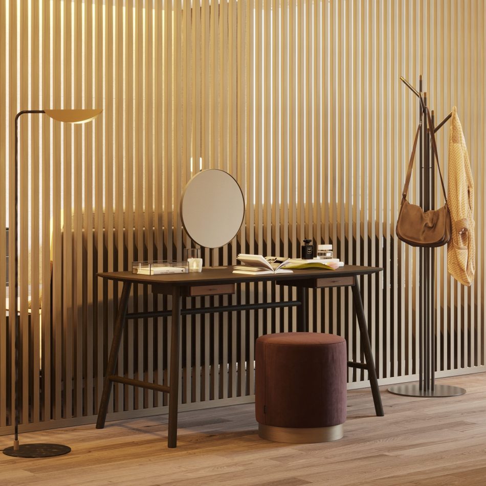 The Landform Dressing Table settles into a warm, intimate space, its dark wood surface paired with a round mirror and quiet objects that invite slow, personal rituals. The angled legs and balanced proportions bring a sense of ease to the room, blending crafted bedroom furniture with gentle mid‑century geometry. The surrounding textures, from the upholstered stool to the soft lighting, create a peaceful atmosphere shaped by thoughtful design details, modern luxury furniture, and subtle interior design inspiration.