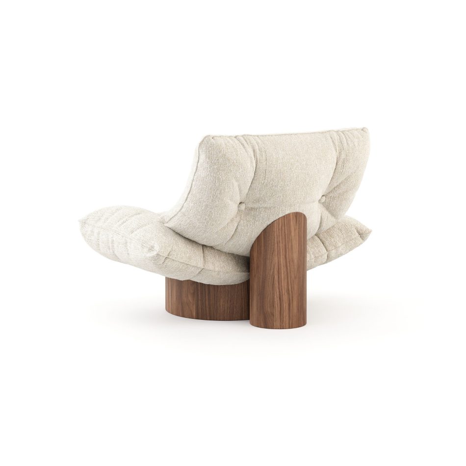 Rear perspective of the Antónia armchair highlighting the architectural solid wood support pillar, curved silhouette, and fine craftsmanship.